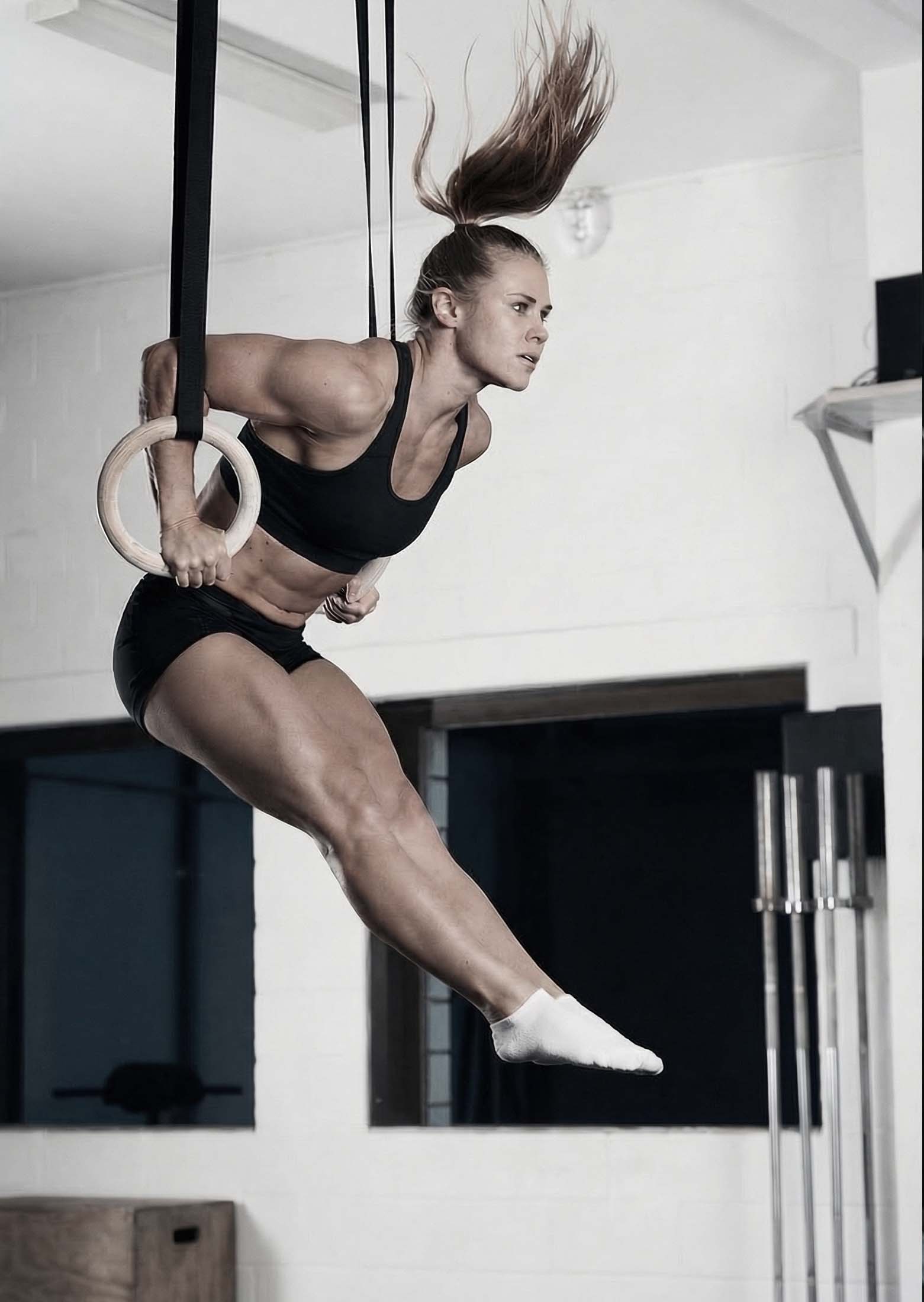 Athlete performing a muscle-up on gymnastic rings